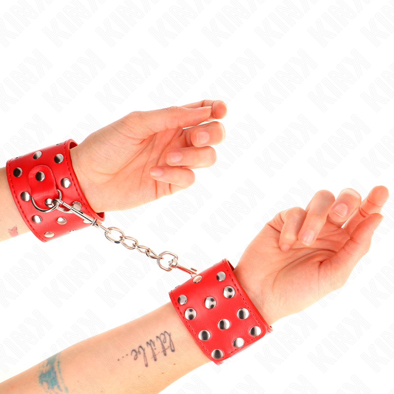 KINK - WRIST RESTRAINTS WITH SNAP FASTEN FULL OF RIVETS RED ADJUSTABLE 19-24 CM X 5.5 CM - Amore24