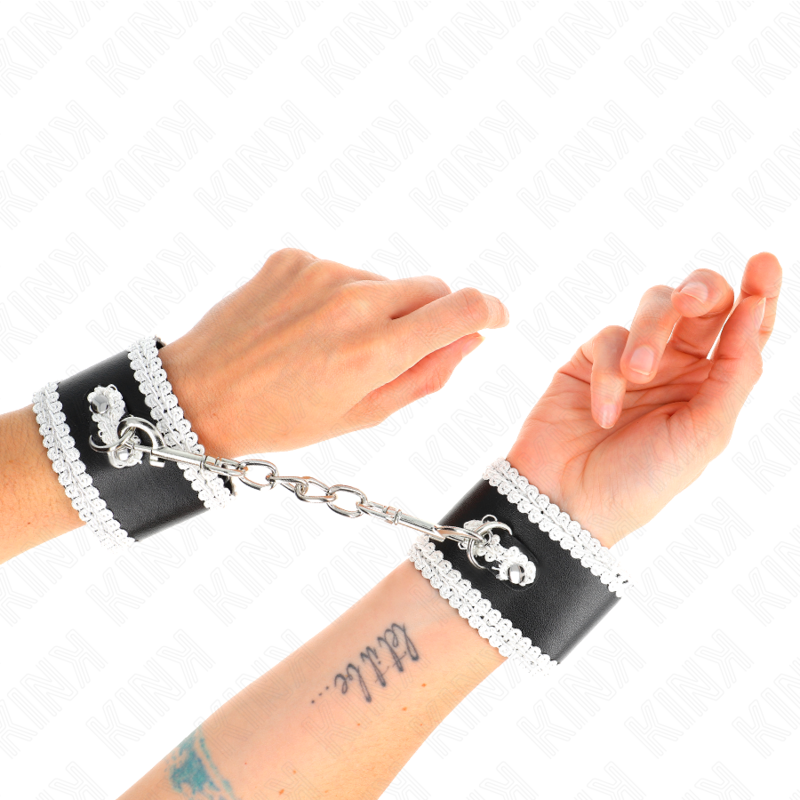 KINK - BLACK WRIST RESTRAINTS WITH WHITE DECORATE LACE ADJSUTABLE 20-23 CM X 5.5 CM - Amore24